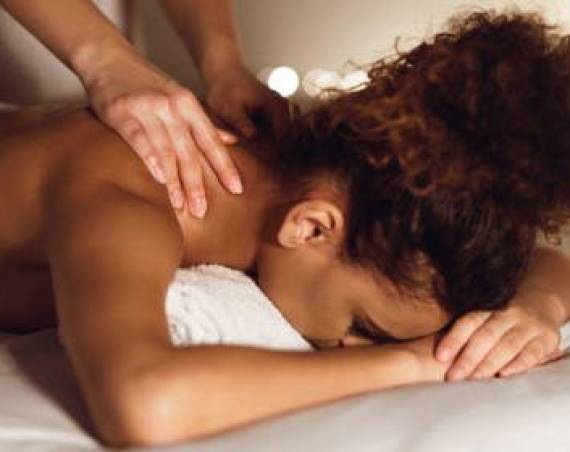 woman-enjoying-therapeutic-neck-massage-in-spa-GMDE84J.jpg